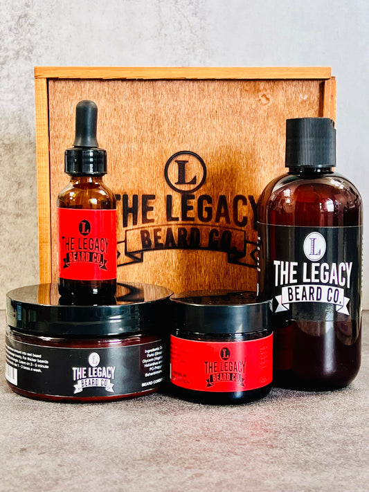 Beard kit wil a white background on a concrete surface. This Kit includes:8 oz. Beard Wash, 8 oz., Beard Conditioner, 3 oz. Beard Enhancer, 1 oz. Beard Oil, Wood keepsake box